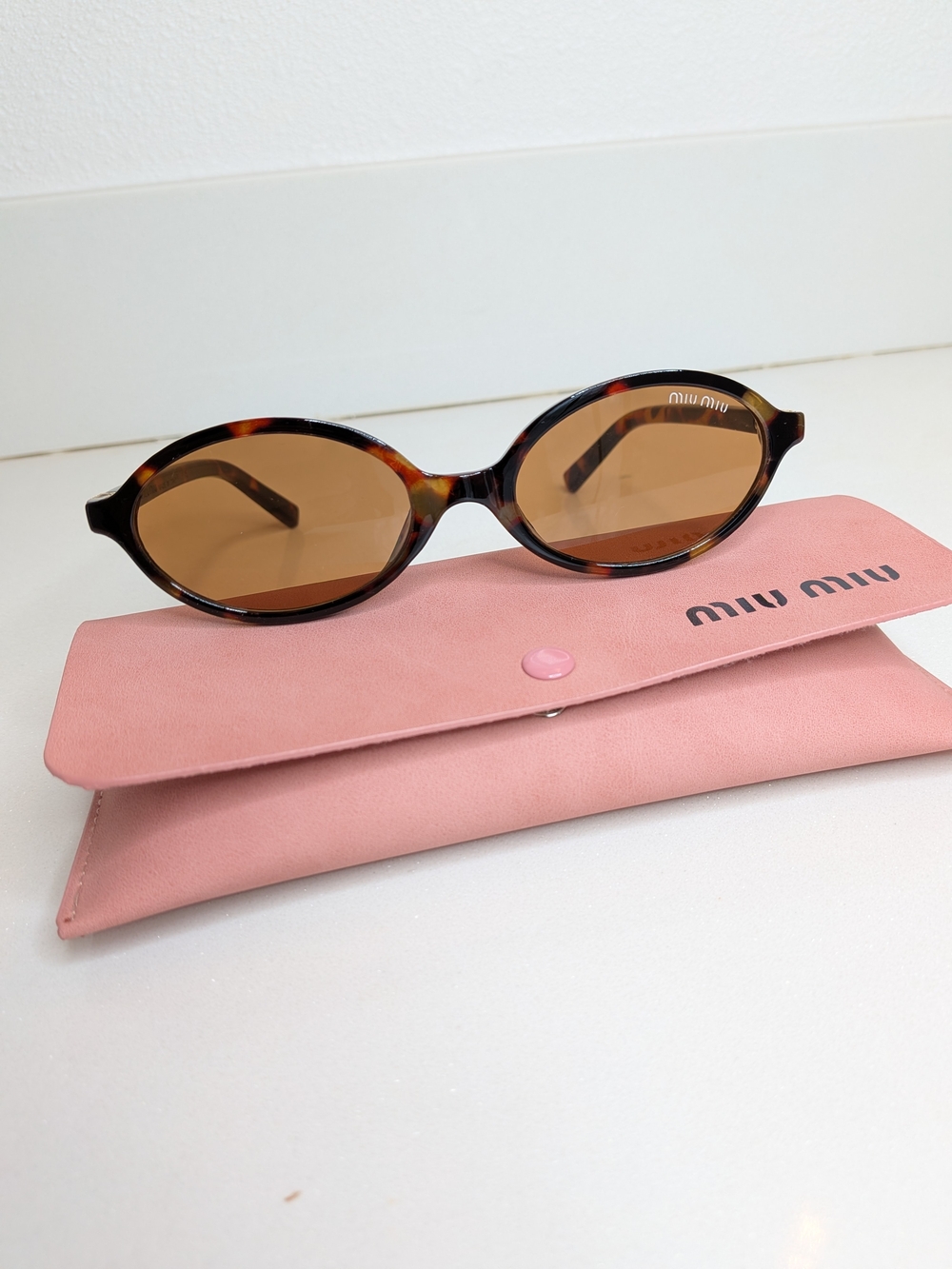 Miu Miu Tortoiseshell Oval Sunglasses in Brown - Picture 2 of 11